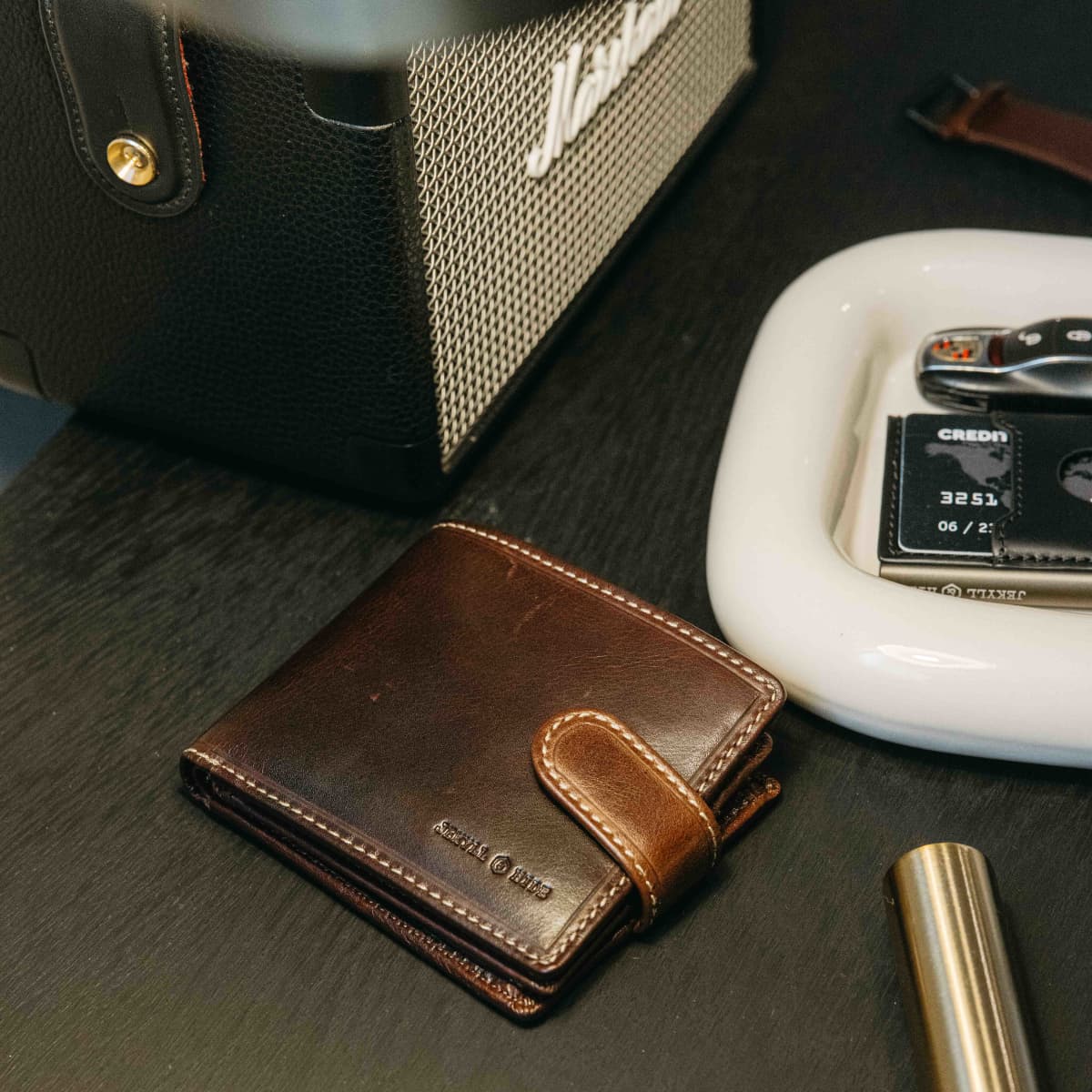 Close-up of the Mocha leather Wallet With Coin on a dark bedside table