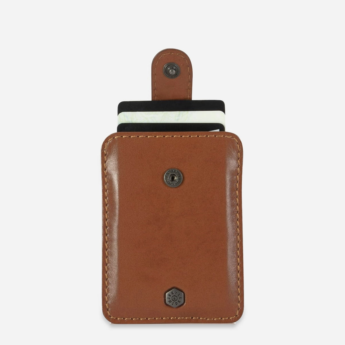 Jekyll & Hide Tab Card Holder in tan leather with cards raised by its pull tab