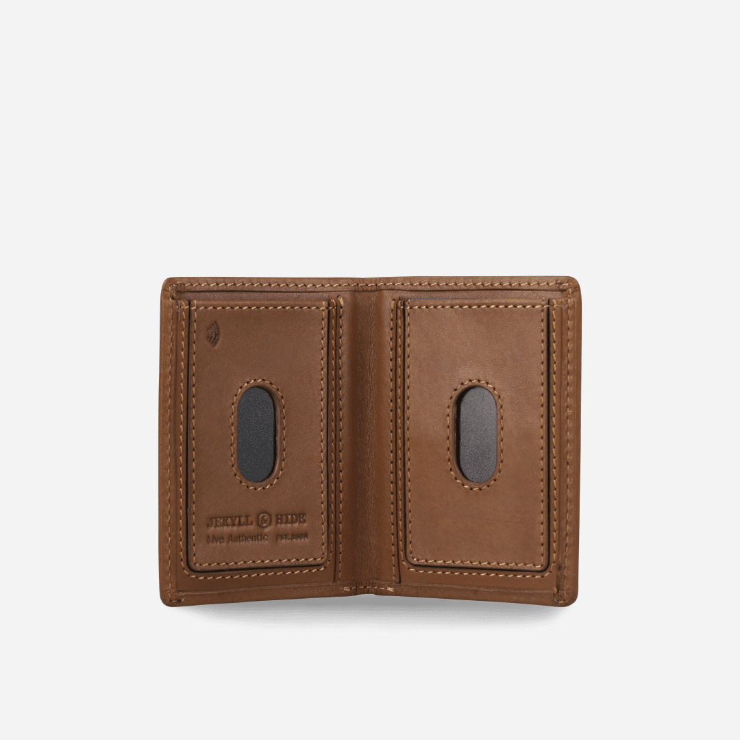 Tan leather Card Holder open flat, showing two card pockets with thumb cut-outs and debossed logo