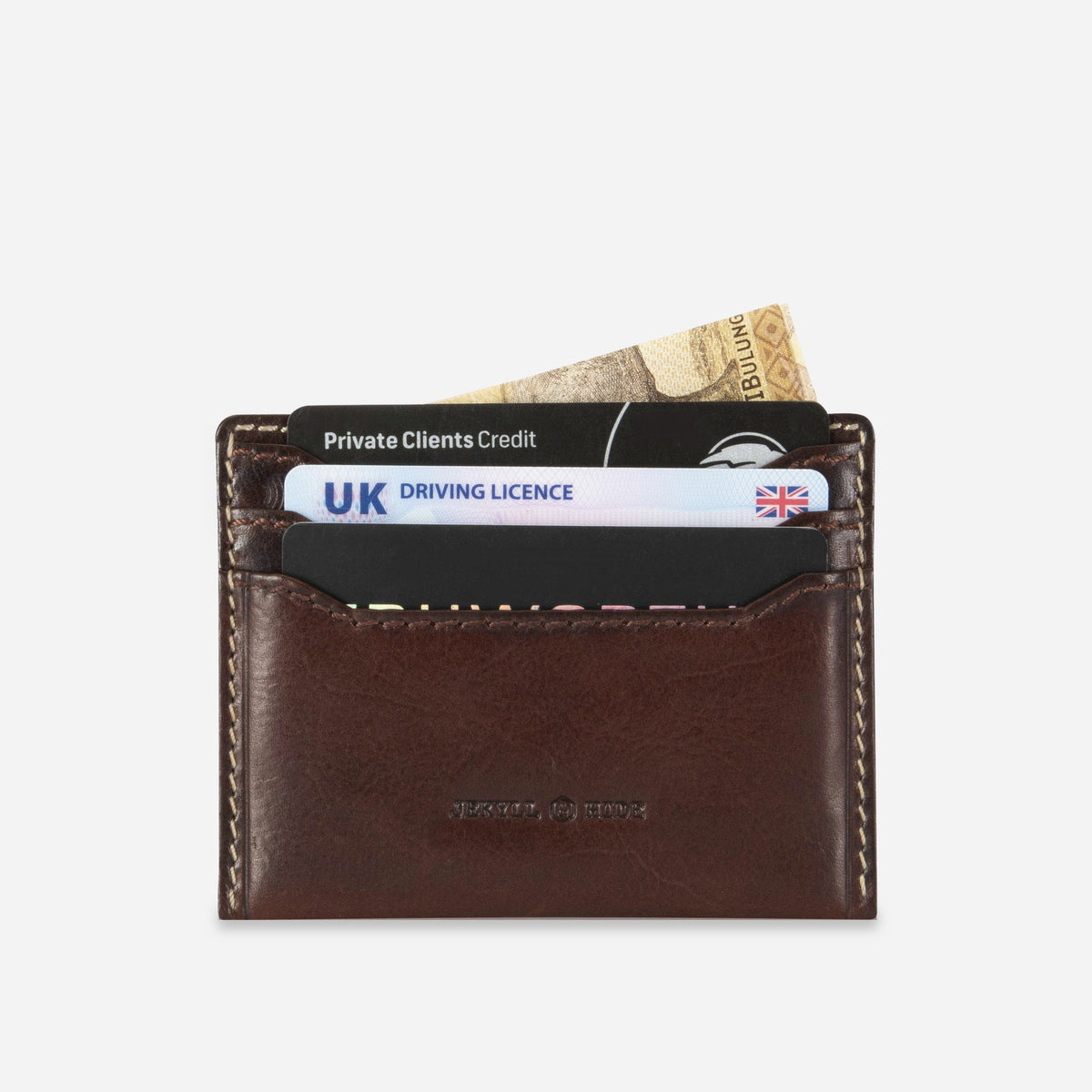 Jekyll & Hide Card Holder in Mocha leather, holding cards and notes in its stacked slots
