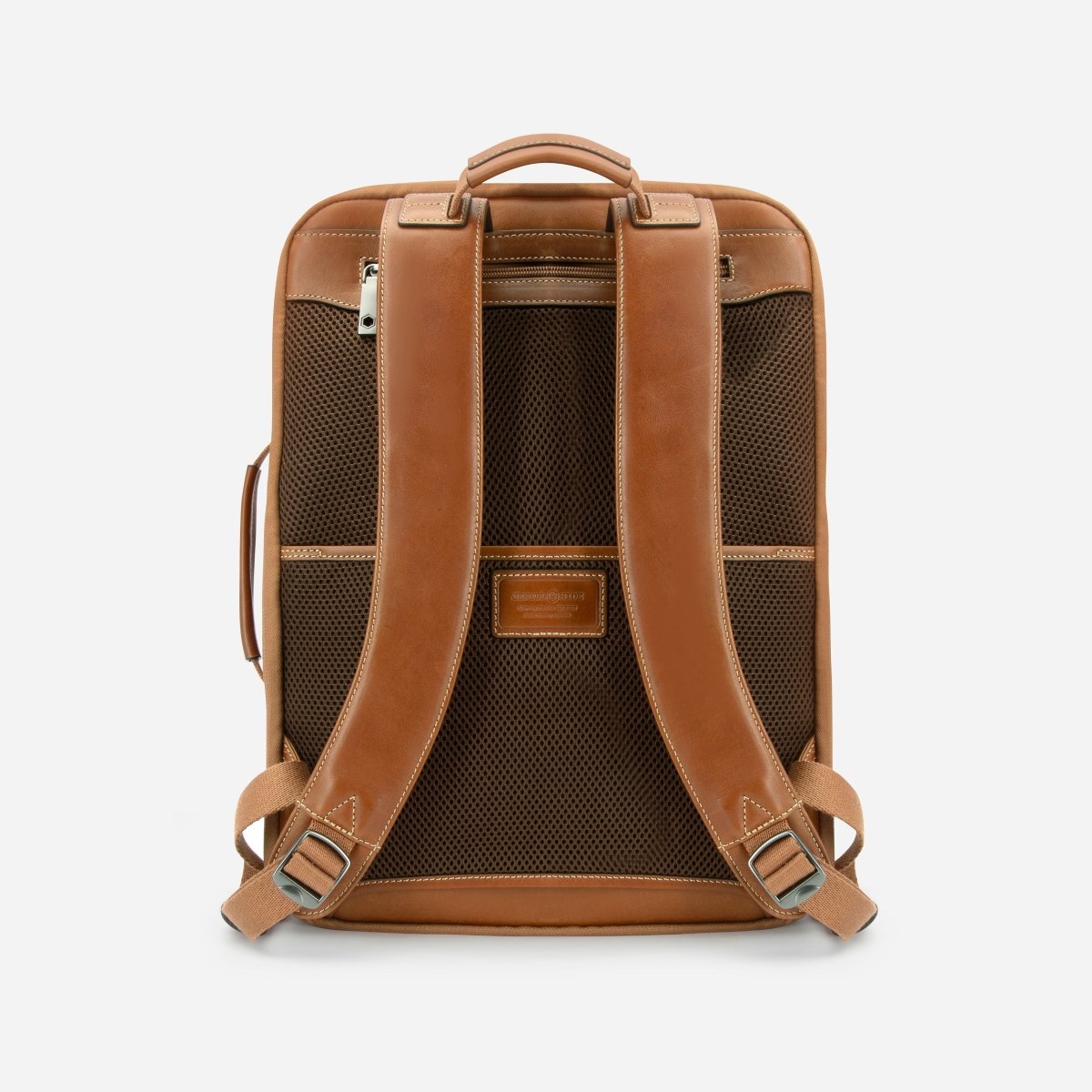 Back view of the tan leather expander backpack showing the padded leather and mesh straps – Jekyll & Hide