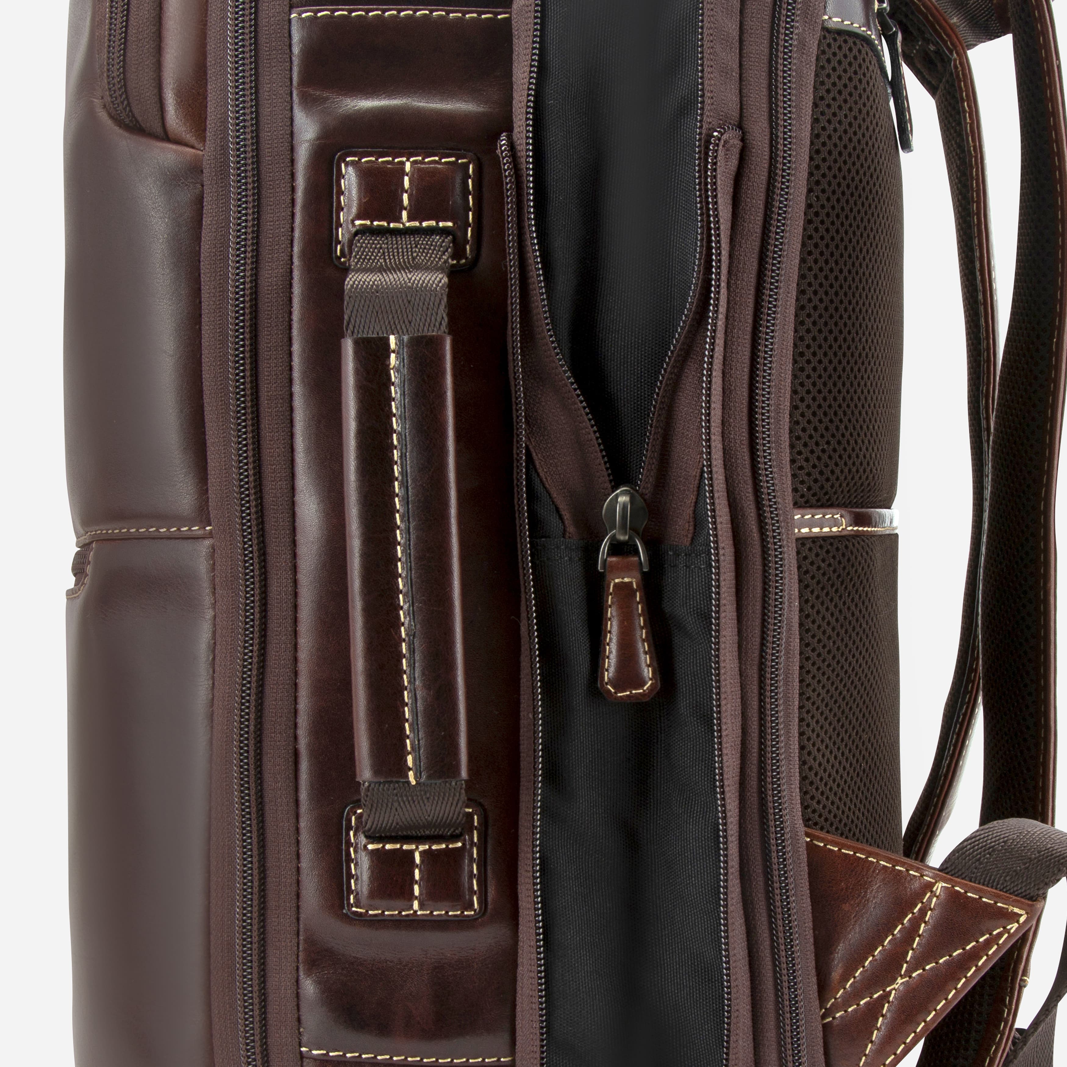 Close-up of mocha leather expander backpack straps and top handle