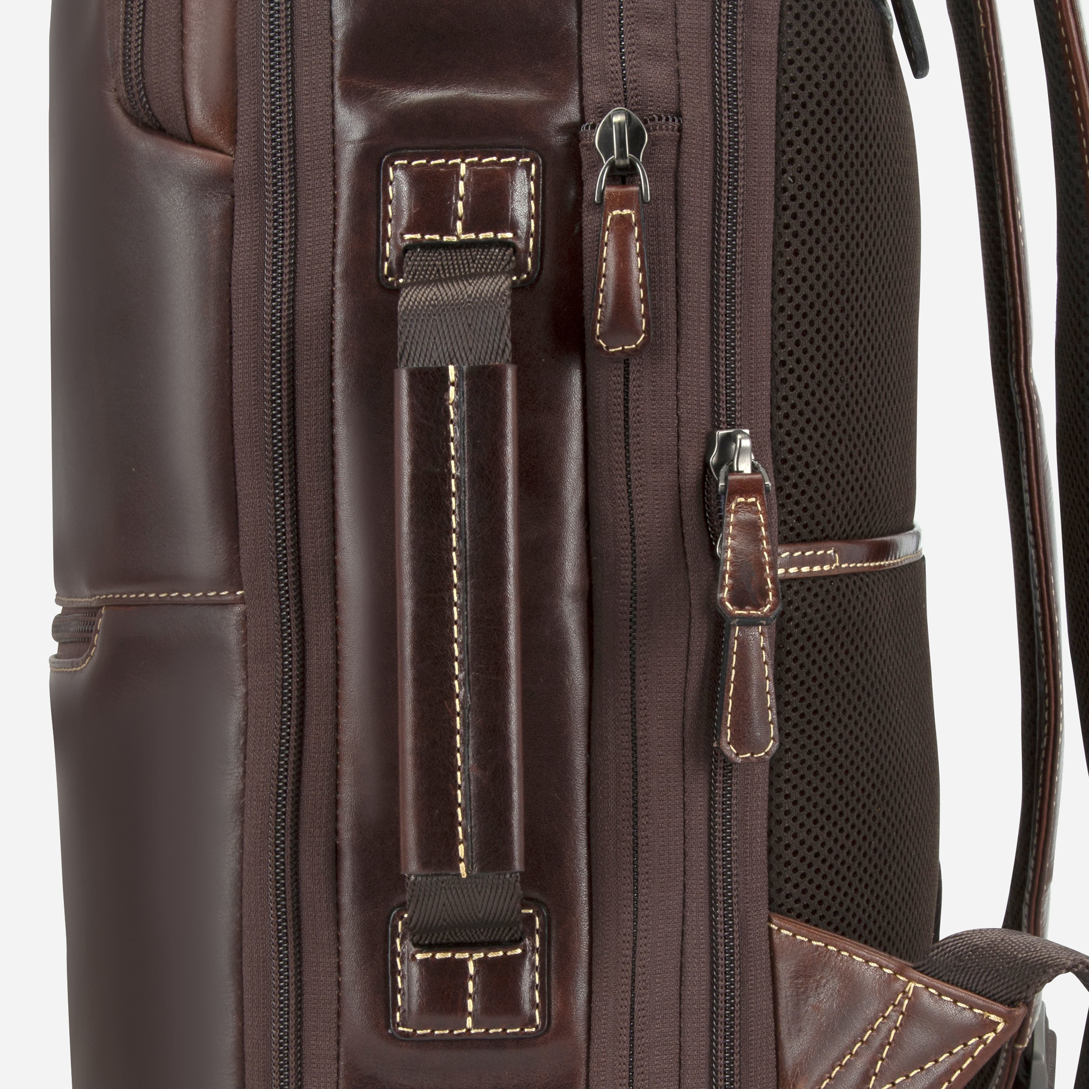 Close-up of mocha leather expander backpack zip pocket and stitching detail