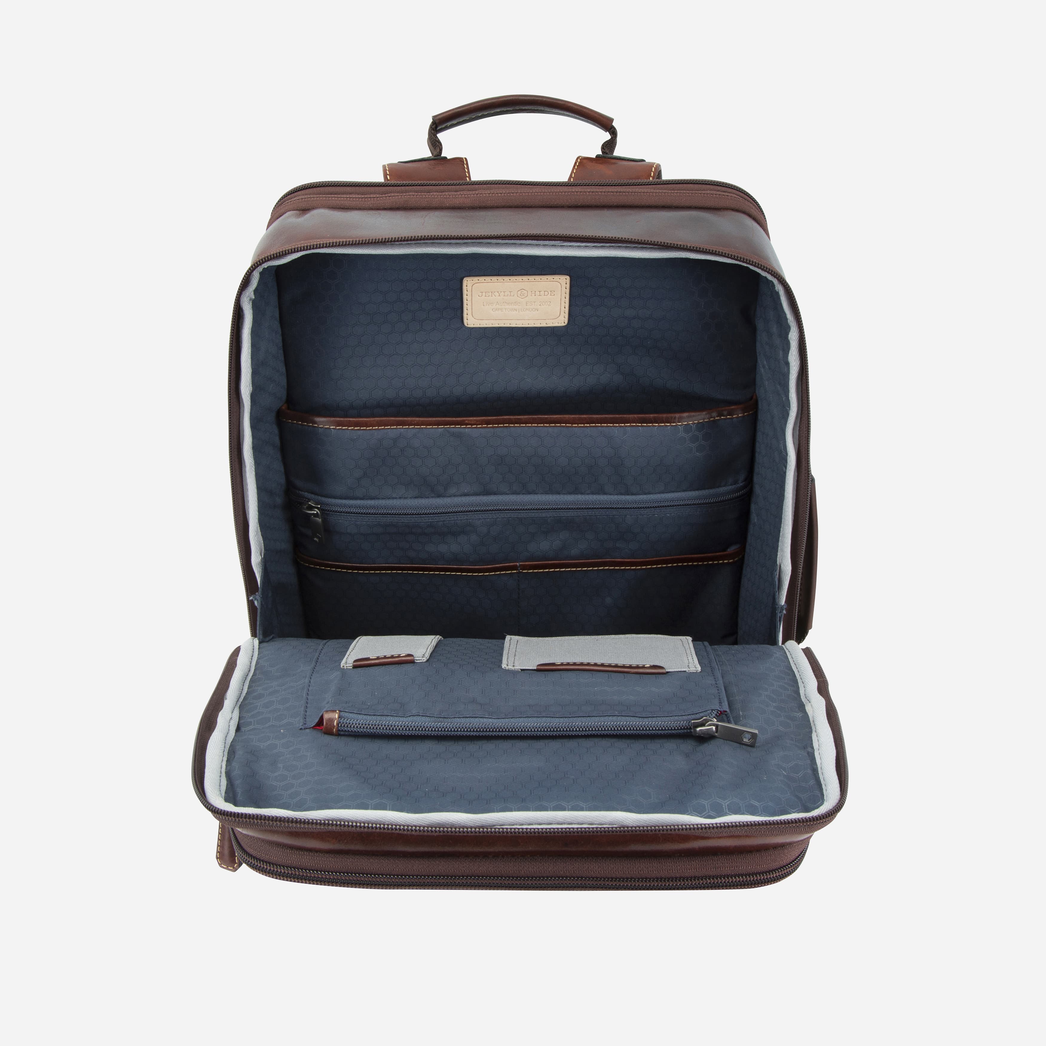 Open mocha leather expander backpack showing blue-lined laptop compartment