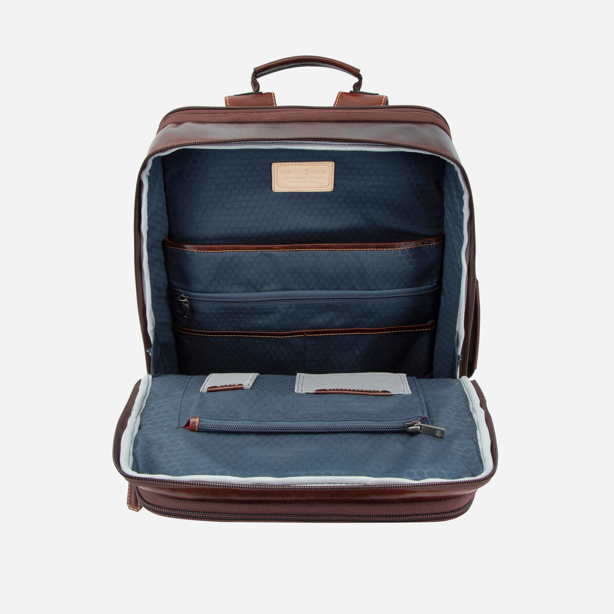 Mocha Expander Backpack opened out, showing navy lined organiser pockets and laptop section