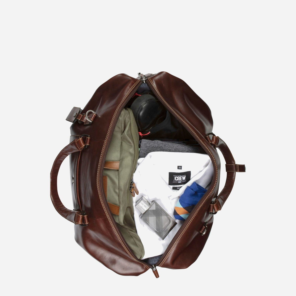 Mocha leather Weekender unzipped and packed with shirts, shoes and toiletries