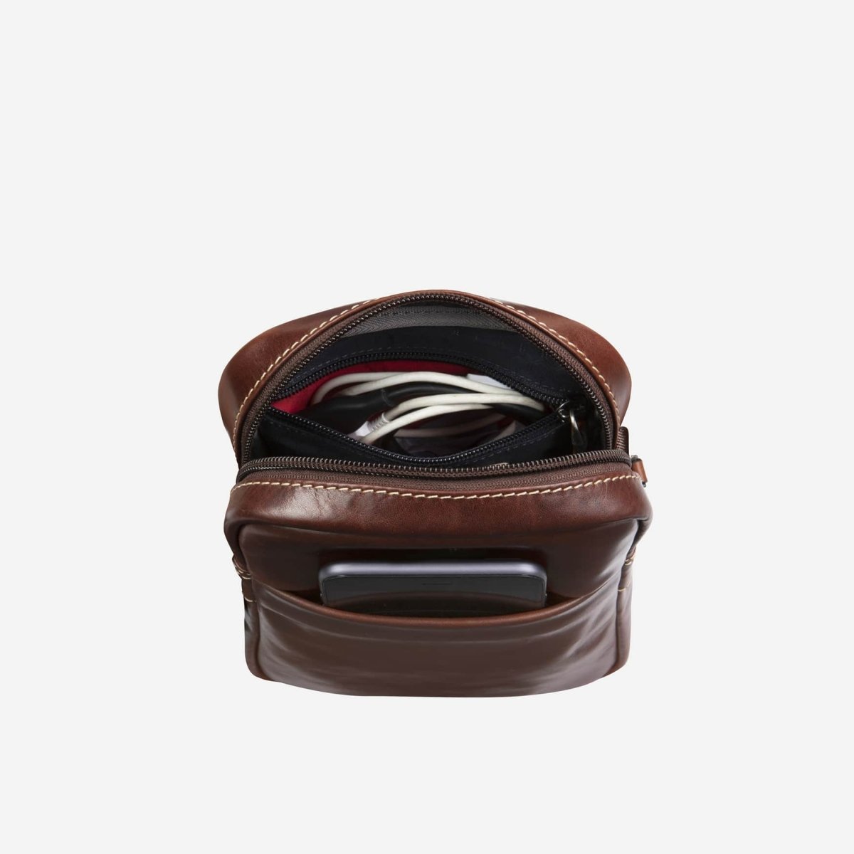 Mocha Crossbody Organiser open, holding cables, a power bank and phone