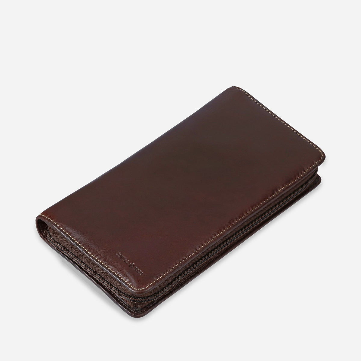 Angled view of the closed Mocha leather Travel Organiser with zip-around closure