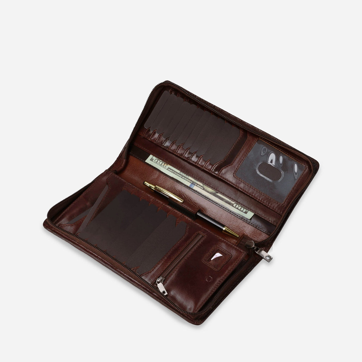 Mocha leather Travel Organiser open at an angle with pen, notes and cards inside