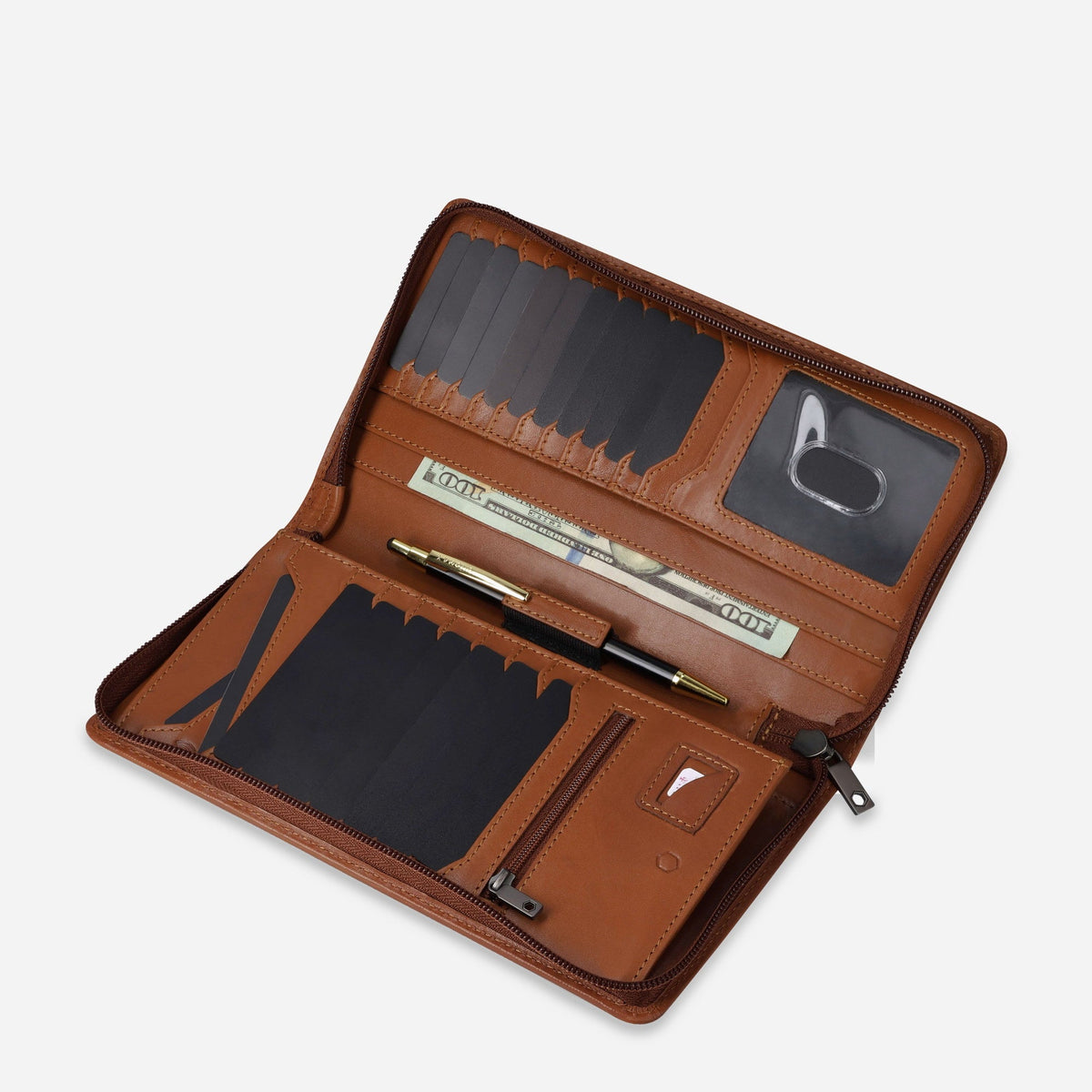 Tan leather Travel Organiser open at an angle with pen, notes and cards inside