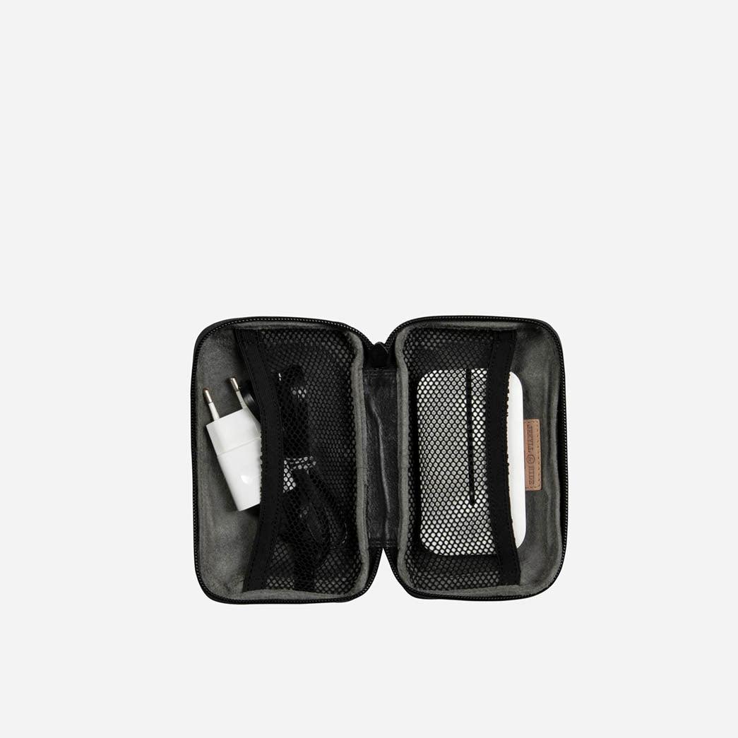 Black Cable Pouch opened flat with a charger and cables in mesh pockets
