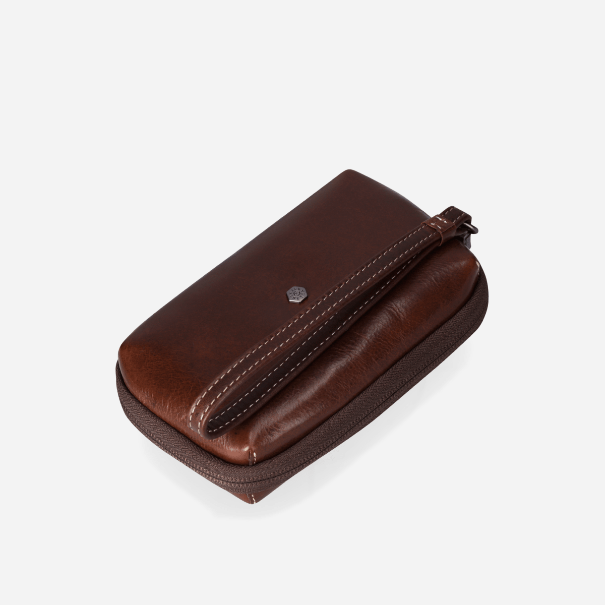 Angled view of the Mocha leather Cable Pouch with wrist strap and logo stud