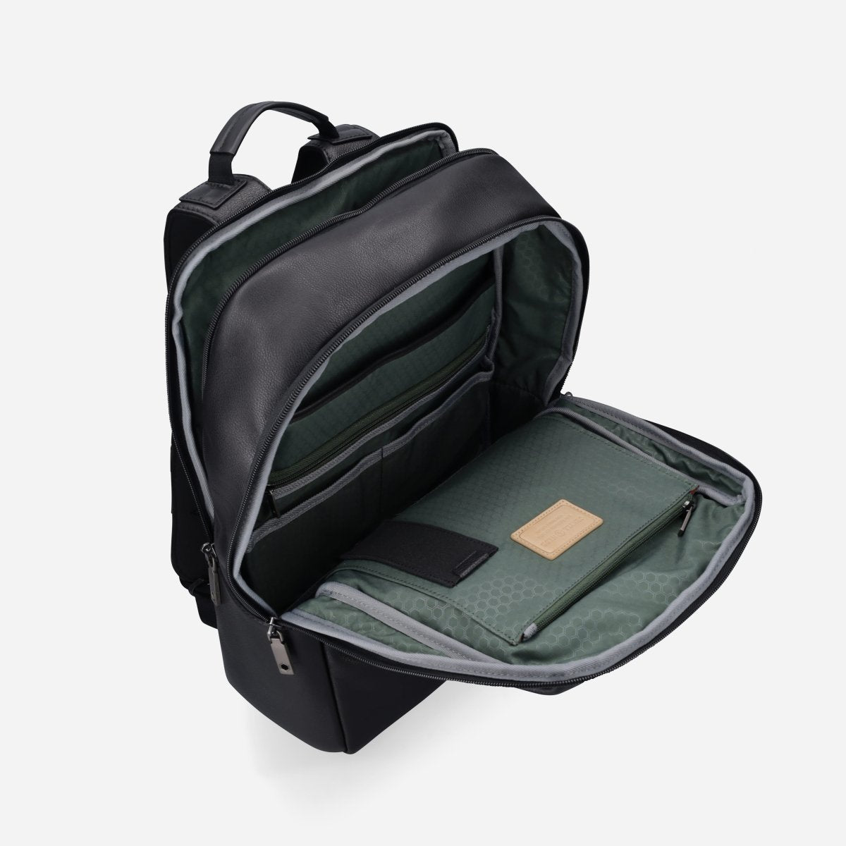 Black leather laptop backpack opened to show the green-lined compartment and organiser – Jekyll & Hide