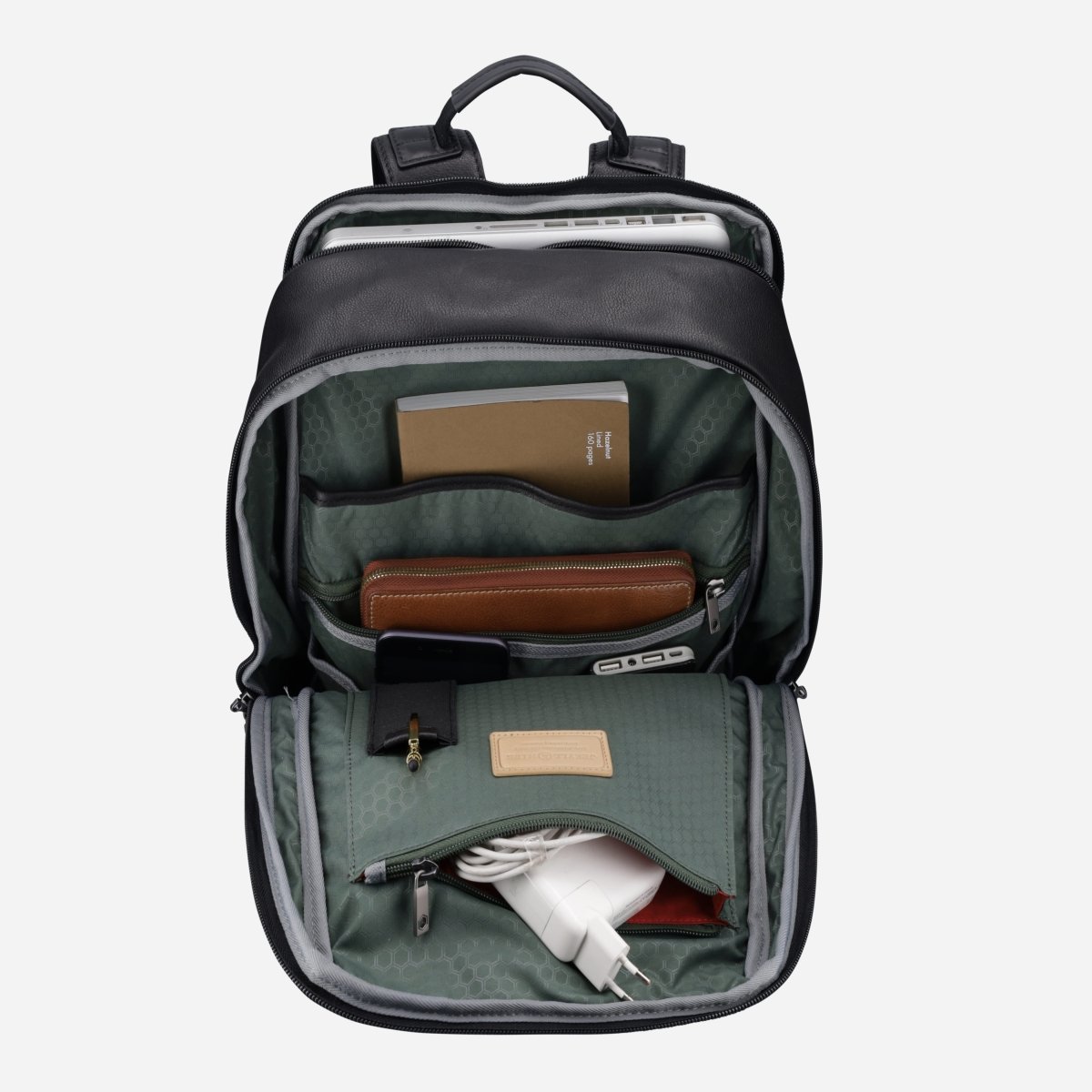 Black leather laptop backpack opened and packed with a laptop, notebook, wallet and charger – Jekyll & Hide