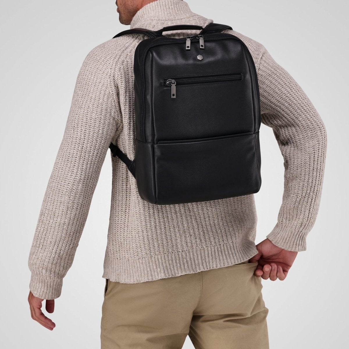 Man wearing the black leather laptop backpack on his back – Jekyll & Hide