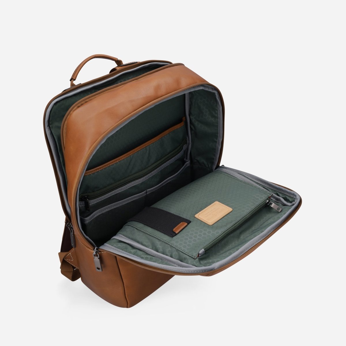 Tan leather laptop backpack opened to show the green-lined compartment and organiser – Jekyll & Hide