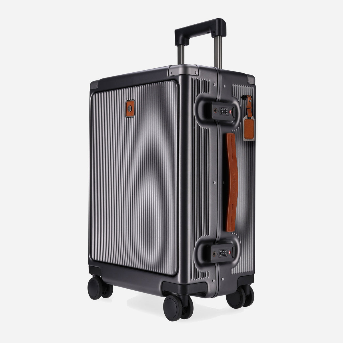 Jekyll & Hide Carry-on suitcase in grooved gunmetal hardshell with Colt tan leather handles, three-quarter view