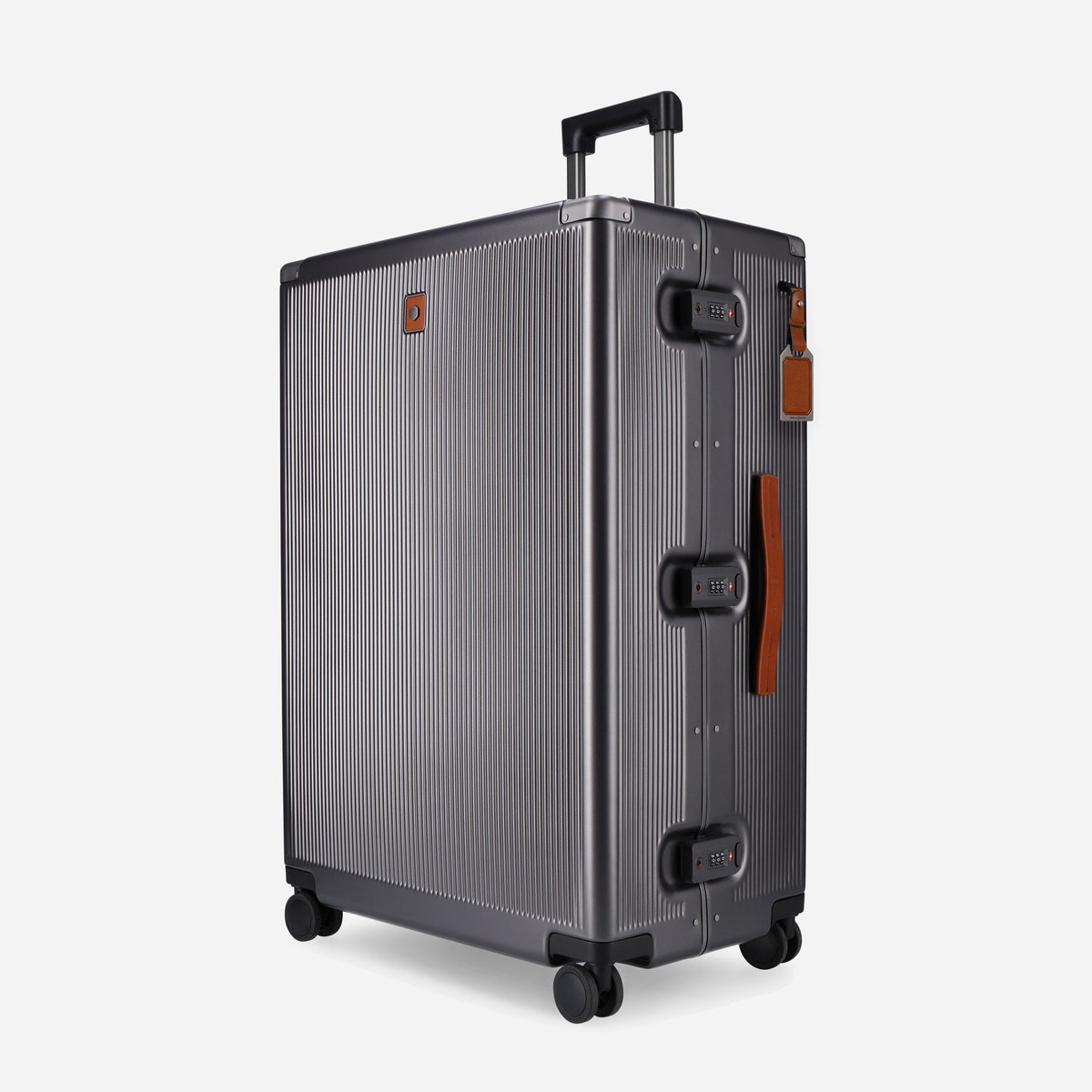 Jekyll & Hide Large Check-In suitcase in grooved gunmetal hardshell with Colt tan leather handles, three-quarter view