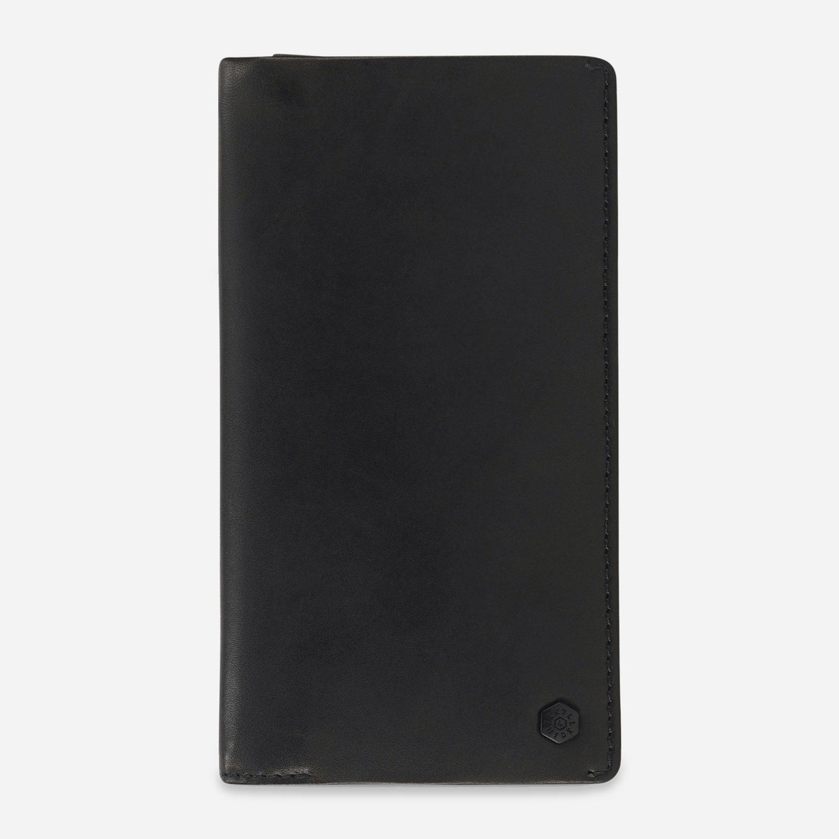 Jekyll & Hide Travel Wallet in black leather, a slim long wallet with tonal hexagonal logo, front view