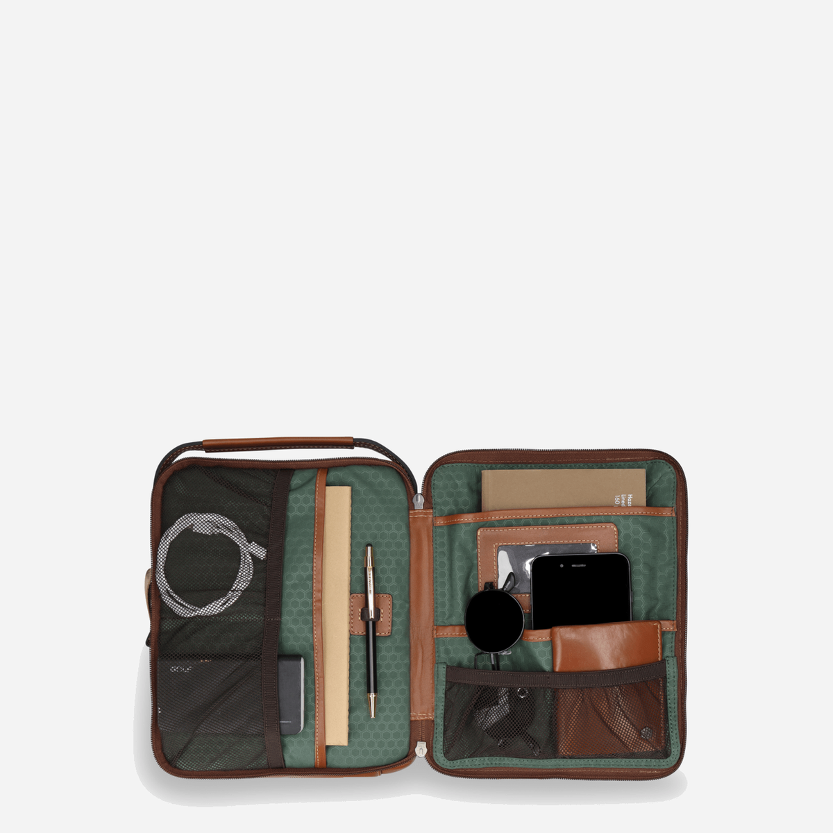 Colt Crossbody Organiser opened flat with cables, a notebook, pen, sunglasses and phone