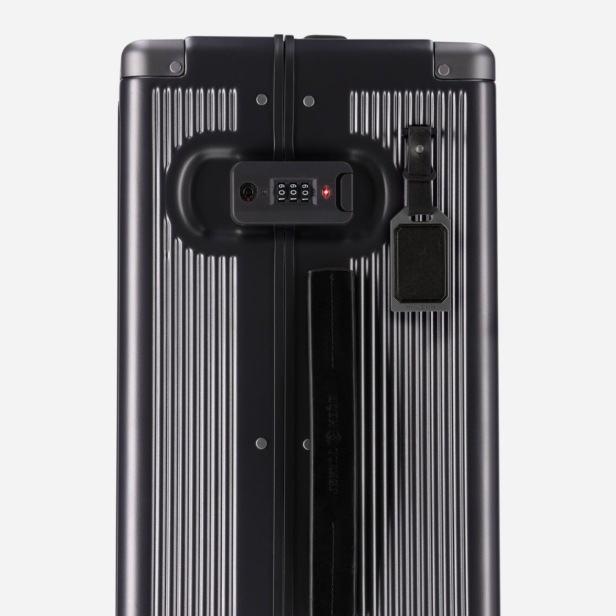Close-up of the TSA lock and grab handle on the Jekyll & Hide graphite-black hardshell Carry-On