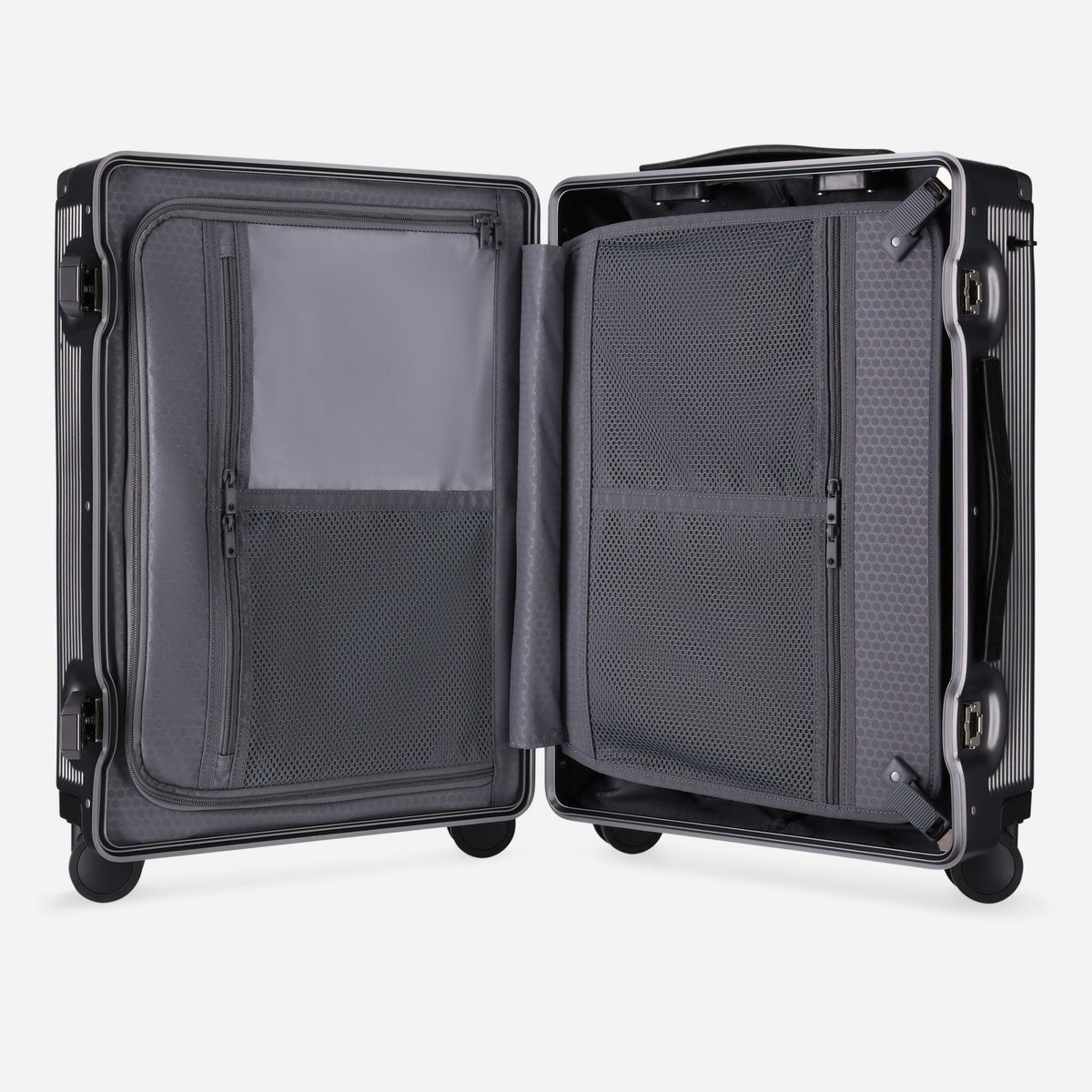 Open Jekyll & Hide graphite-black hardshell Carry-On showing the two-compartment interior with grey lining